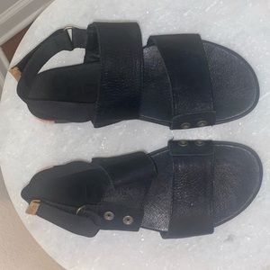 Black Sorel Flats. Size 8.5. Leather Feel with Velcro strap for heel.